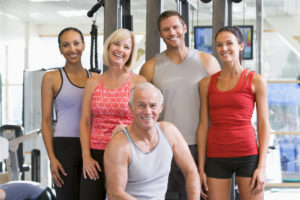 Portrait Of Men And Women Standing At The Gym